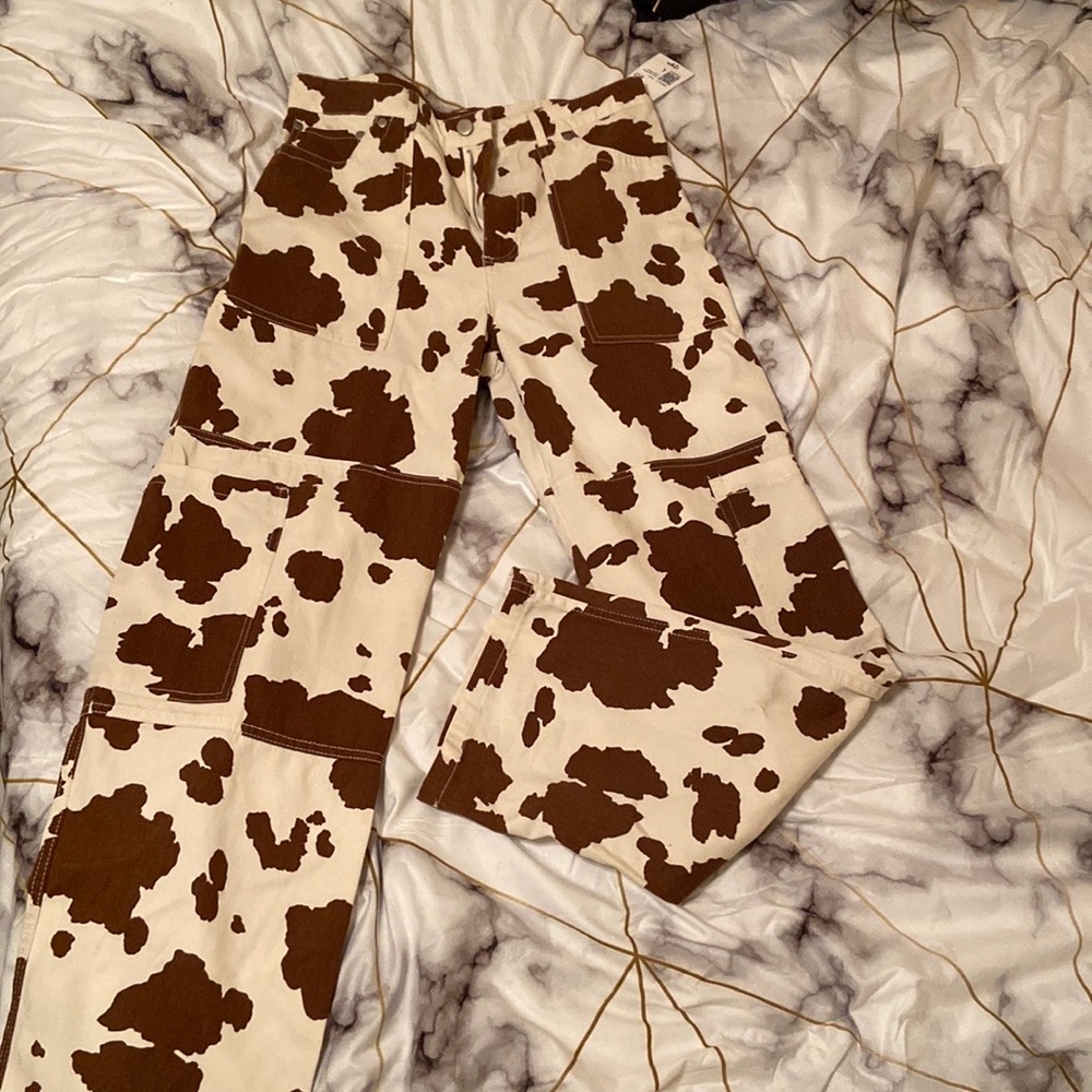 Brown cow print cargo pants. Size: Large